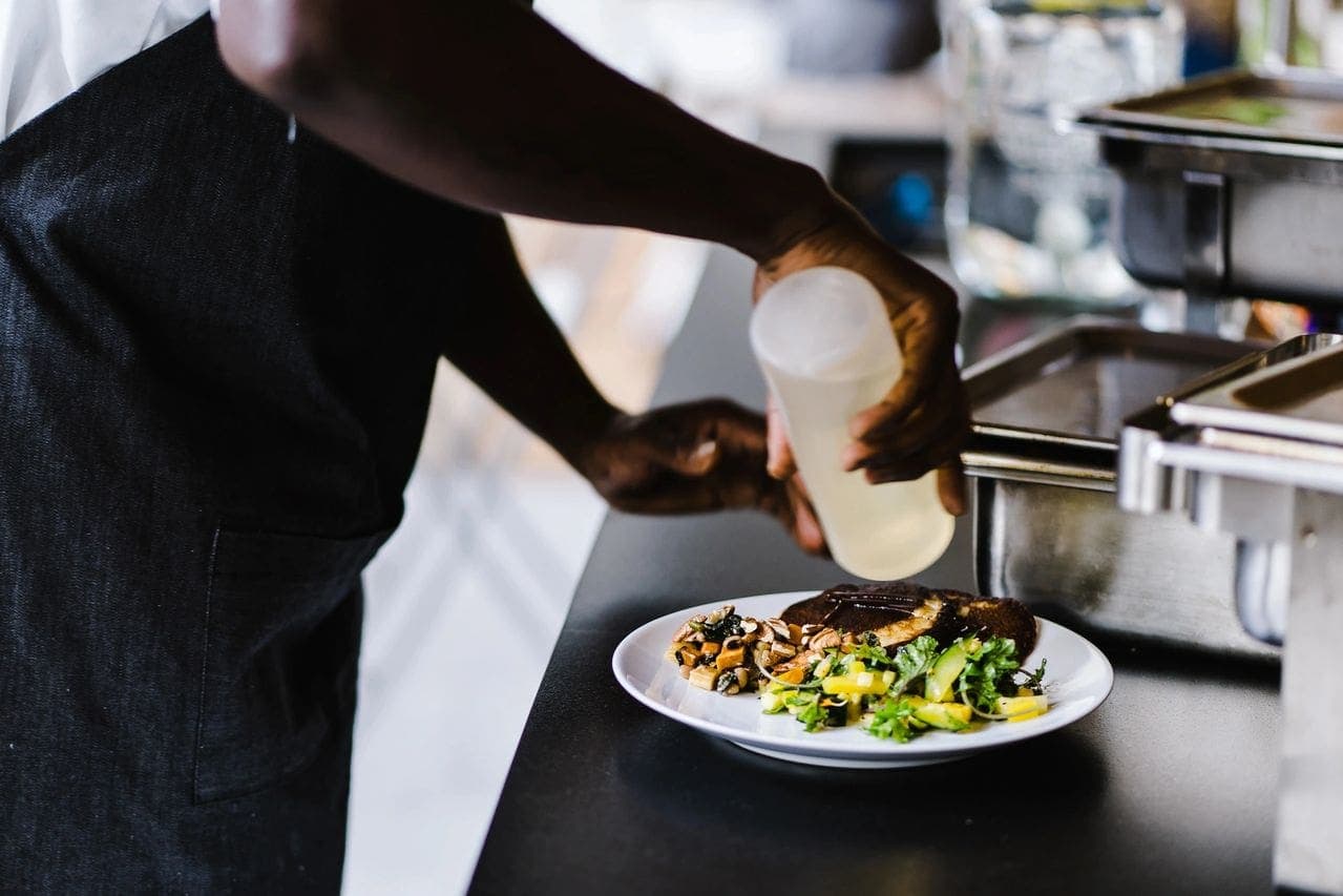 Chef Eric plating a fusion dish